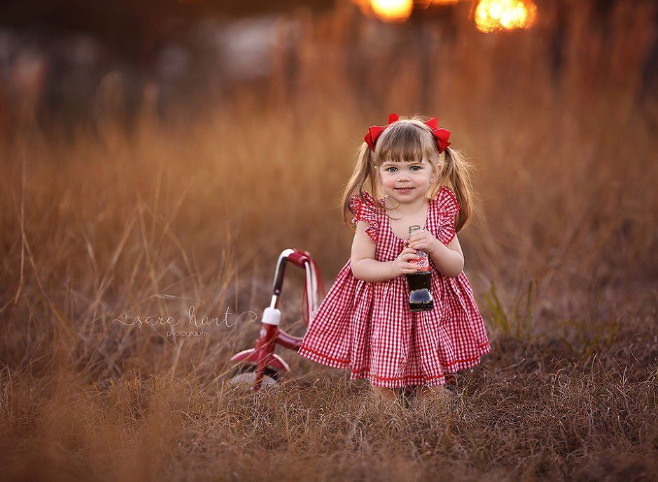 Baby girl holding coca-cola — Pearland, TX — Sara Hunt Photography
