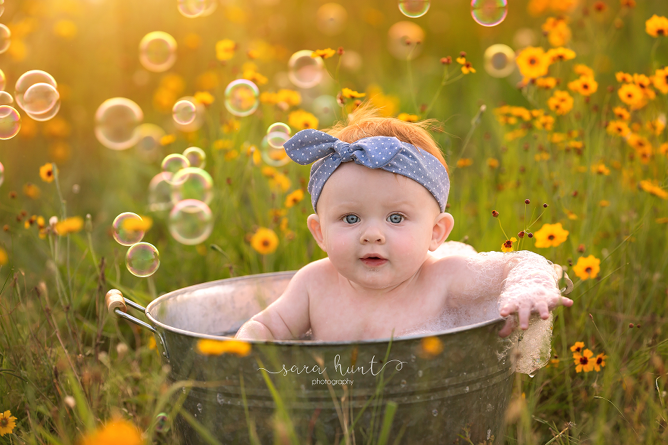 Baby in the basin with yellow flowers and bubbles — Pearland, TX — Sara Hunt Photography