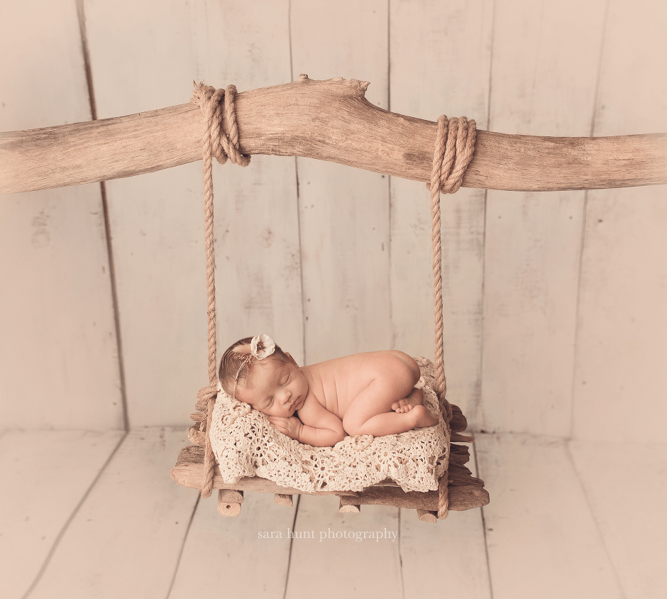 Newborn baby on swing — Pearland, TX — Sara Hunt Photography