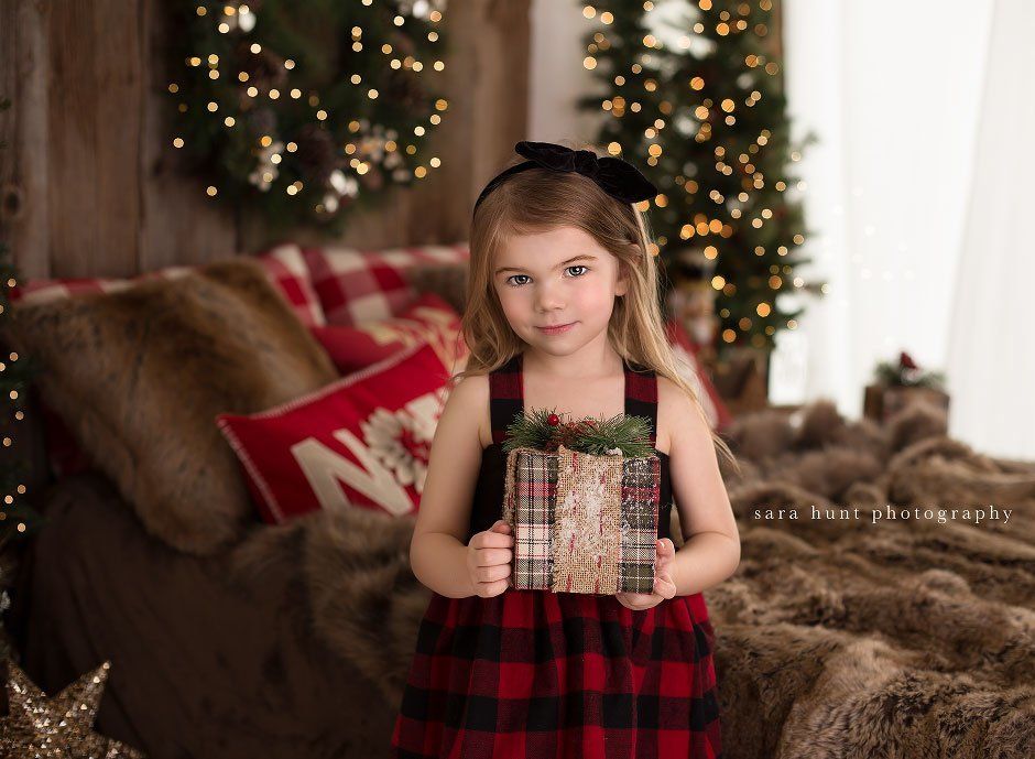 Girl holding gift — Pearland, TX — Sara Hunt Photography