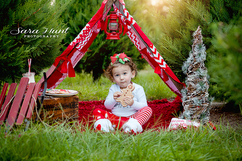 Christmas Tree Farm Portrait — Young Girl Eating Gingerbread in Pearland, TX Christmas Tree Farm Portrait — Young Girl Eating Gingerbread in Pearland, TX