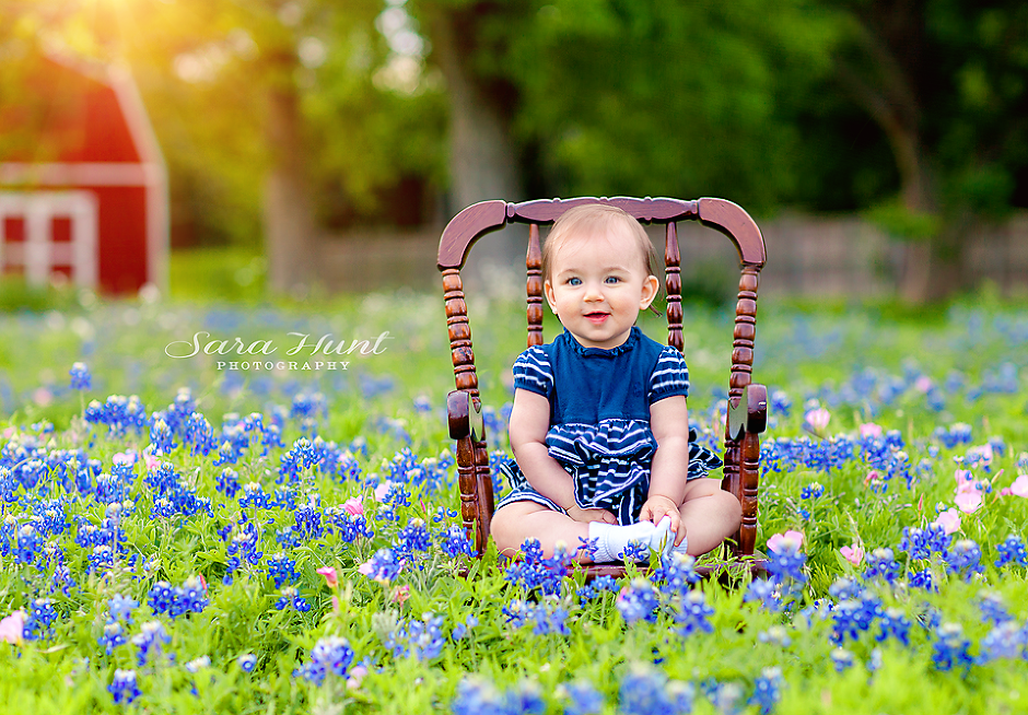 Baby girl with blue eyes sitting on a chair — Pearland, TX — Sara Hunt Photography
