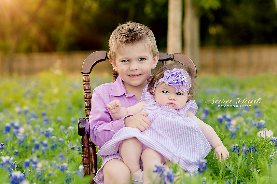 Siblings with blue eyes sitting on a chair — Pearland, TX — Sara Hunt Photography Siblings with blue eyes sitting on a chair — Pearland, TX — Sara Hunt Photography