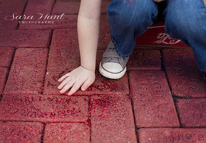 Photo Creator — Kid Holding Glitters on the Ground in Pearland, TX Photo Creator — Kid Holding Glitters on the Ground in Pearland, TX
