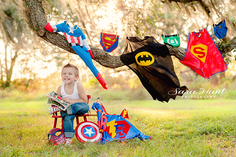 Superhero Birthday Photoshoot — Kid Sitting with Toys in Pearland, TX