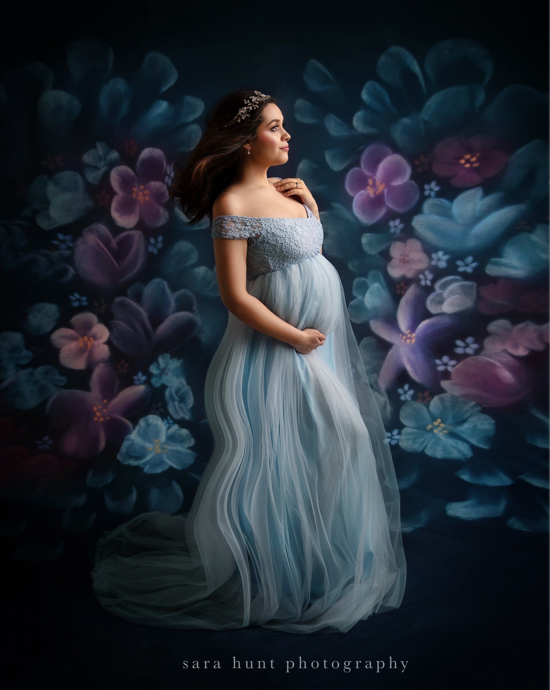 Pregnant woman wearing blue dress with flowers in the background — Pearland, TX — Sara Hunt Photography
