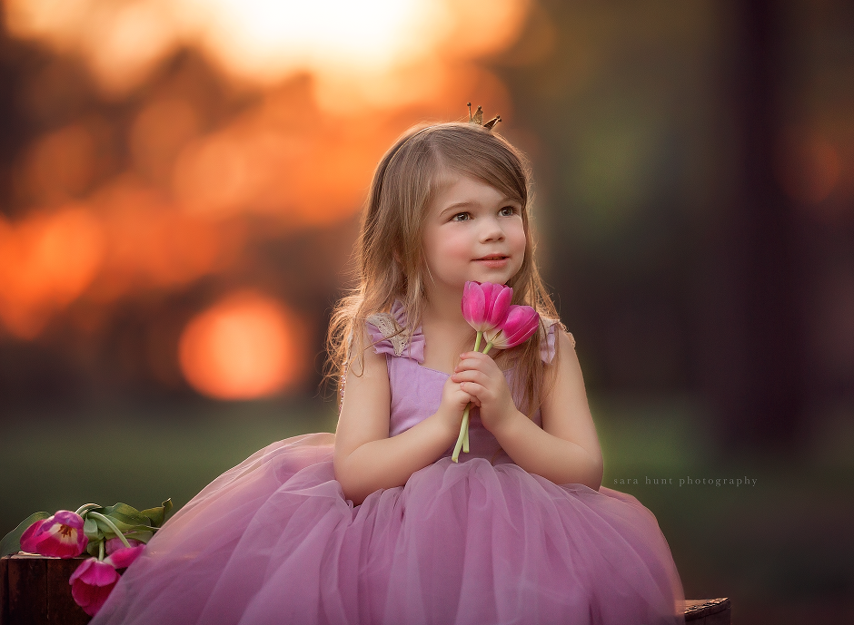 Girl holding two pretty flowers — Pearland, TX — Sara Hunt Photography