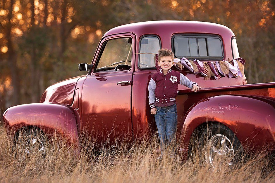 Smiling boy with ATM jacket — Pearland, TX — Sara Hunt Photography