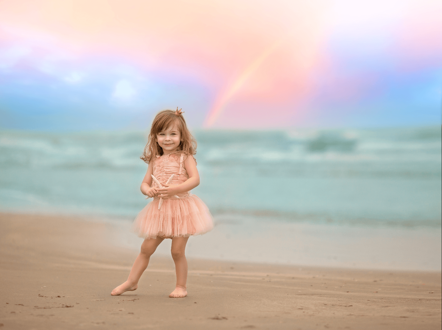 Cute girl in peach tutu while holding a starfish — Pearland, TX — Sara Hunt Photography