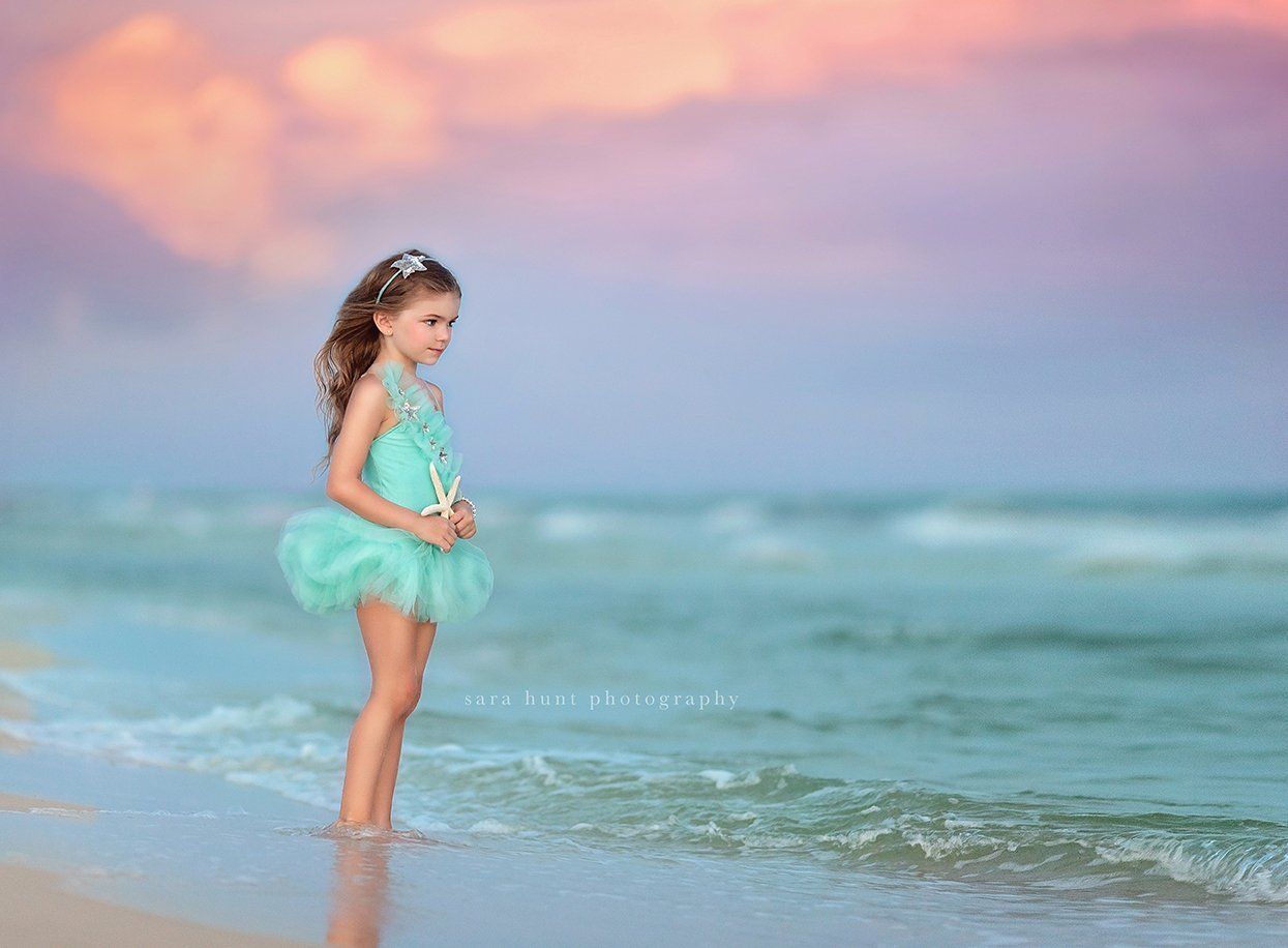 Girl in teal tutu holding a starfish — Pearland, TX — Sara Hunt Photography Girl in teal tutu holding a starfish — Pearland, TX — Sara Hunt Photography