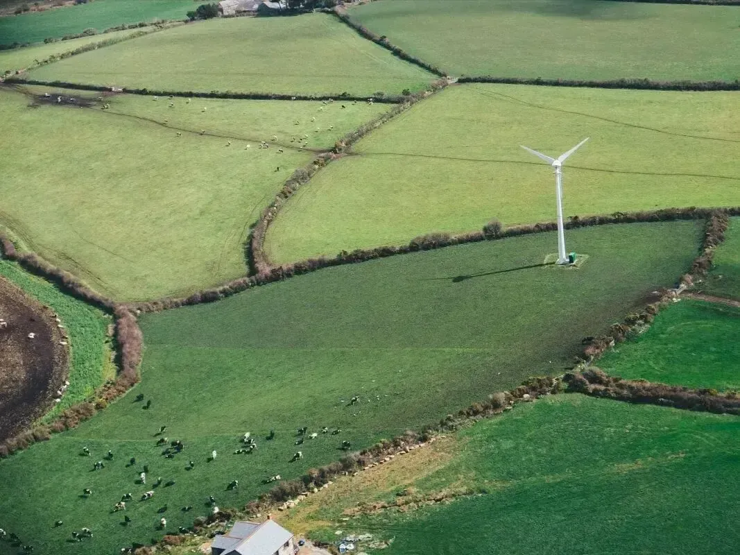 Image of a windmill producing sustainable energy.