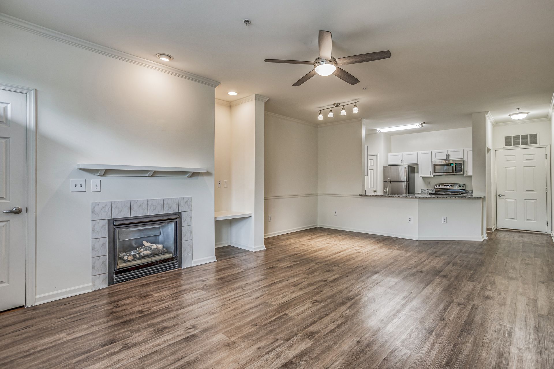 Living room and kitchen at Pine Valley Apartments.