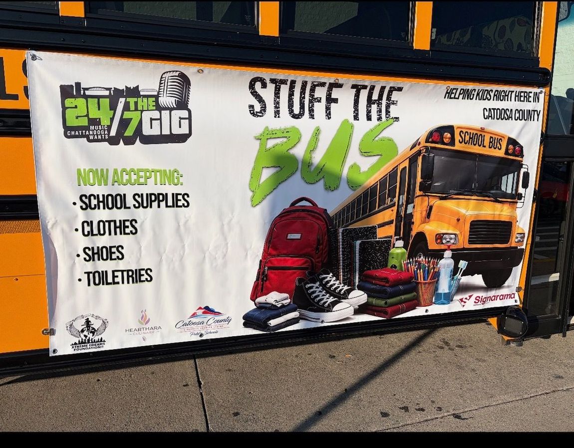 “Stuff the Bus” donation banner for school supplies beside a yellow school bus and backpack.