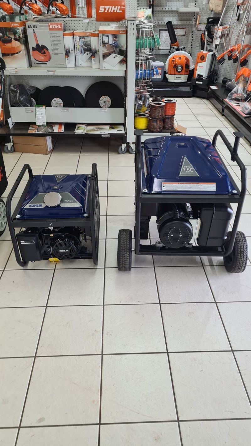 Two Generators Are Sitting on a Tiled Floor in a Store — R & M Motorcycles in Katherine, NT