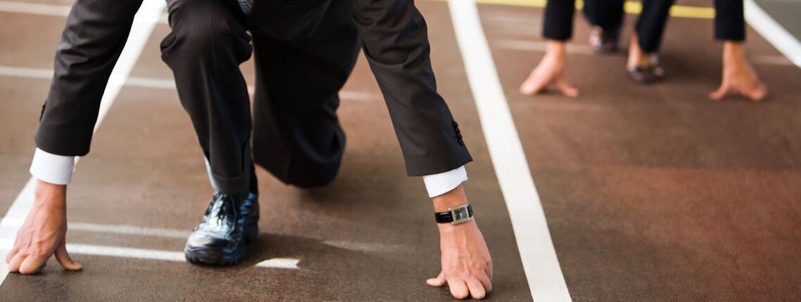 Businessmen at the starting line of a race symbolising starting a business