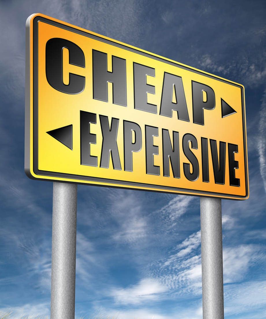 Road sign pointing to 'cheap' website design one way and 'expensive' the other