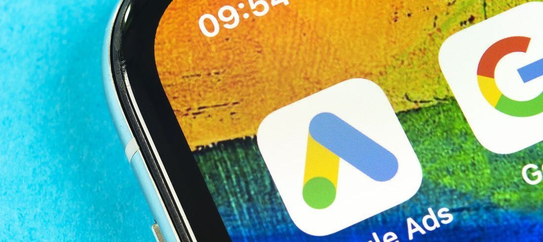 Phone screen with Google Ads icon showing