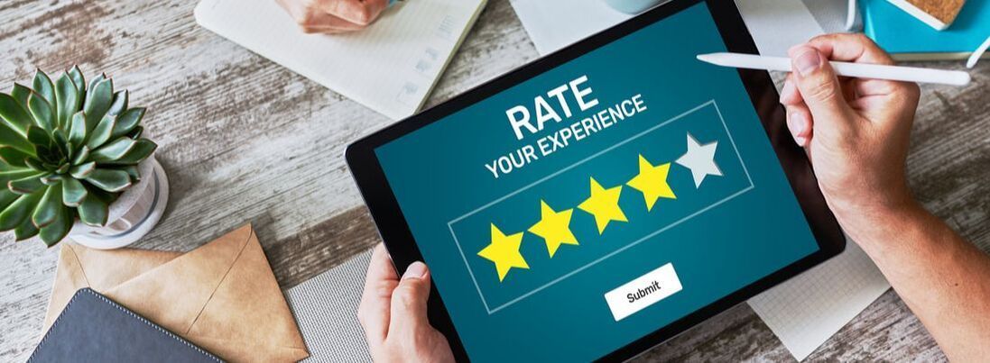 Tablet with 5 star review represented on it