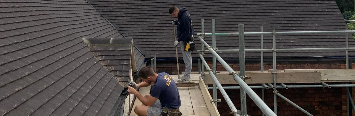Team working on Roof - PJM