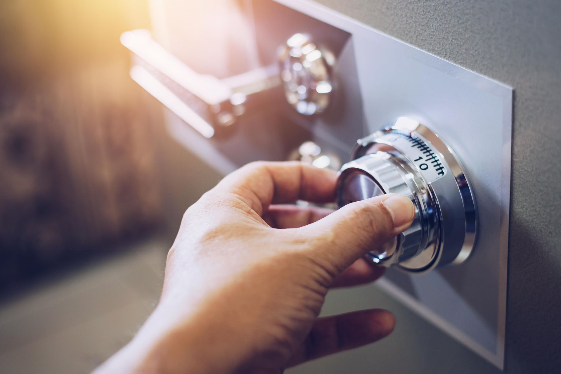 a person is opening a safe with a key .