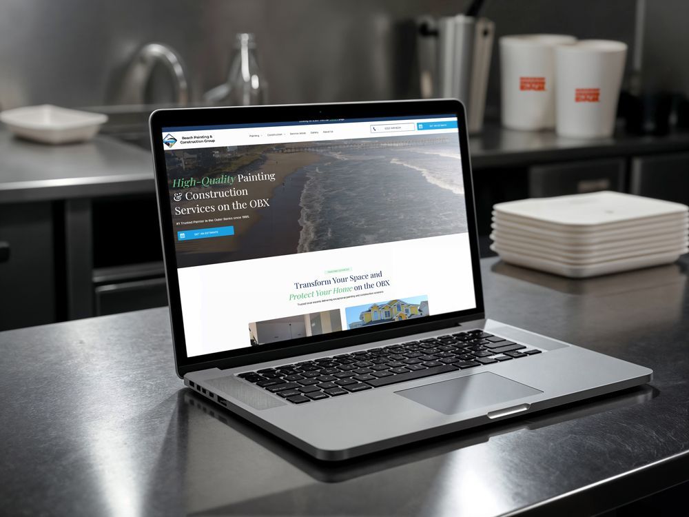 Laptop and smartphone showing a cable and construction services website