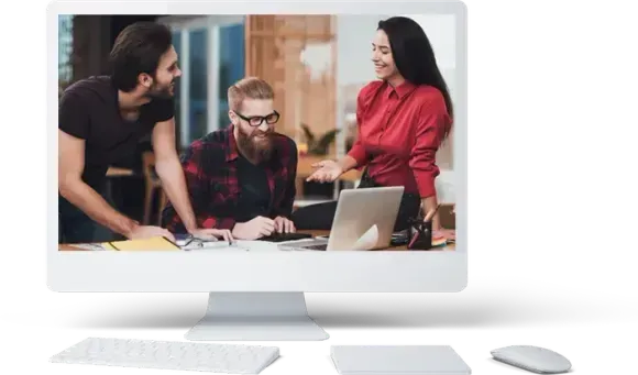 Computer screen showing three colleagues collaborating around a laptop, smiling in an office setting.