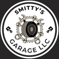 SMITTY’S GARAGE LLC logo with a gear and wrench emblem in black, white, and tan