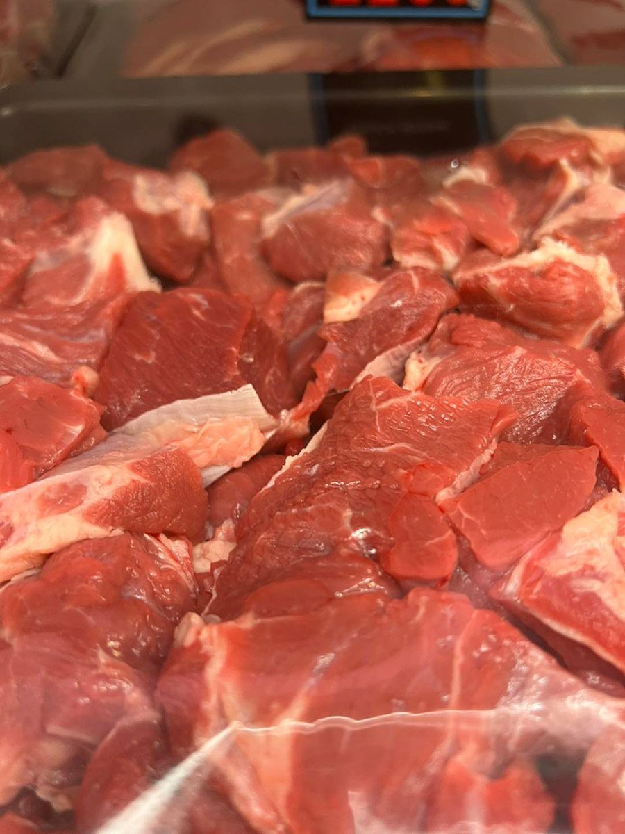 A pile of raw meat in a plastic bag.