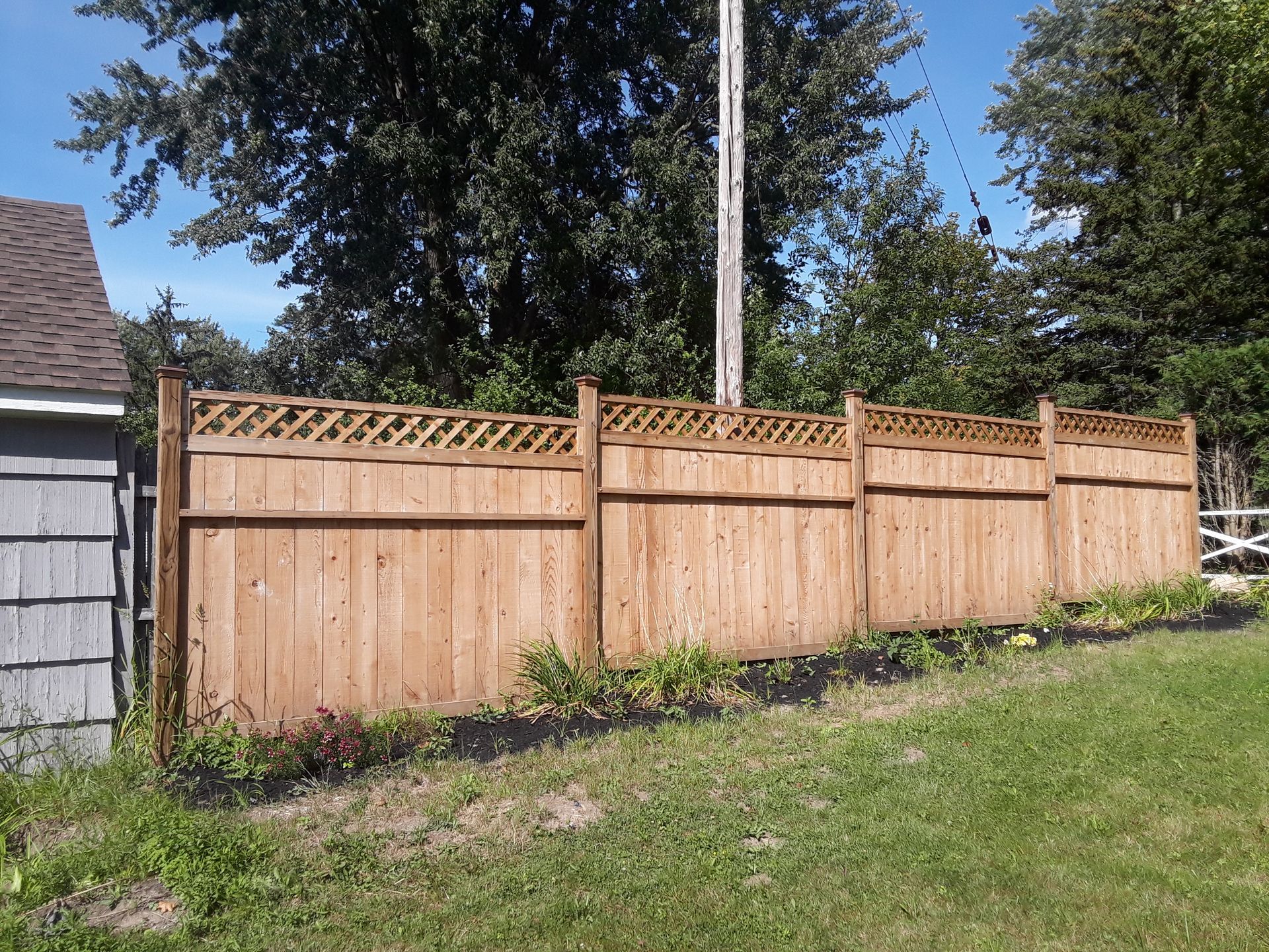 Wood fence installation in Delevan, NY by KKR Fencing