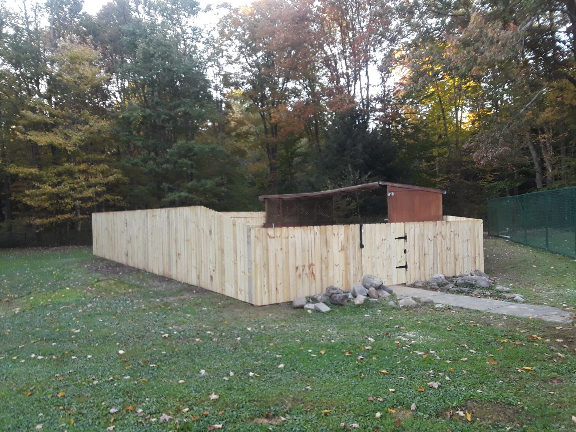 Wood fence installation in Delevan, NY by KKR Fencing