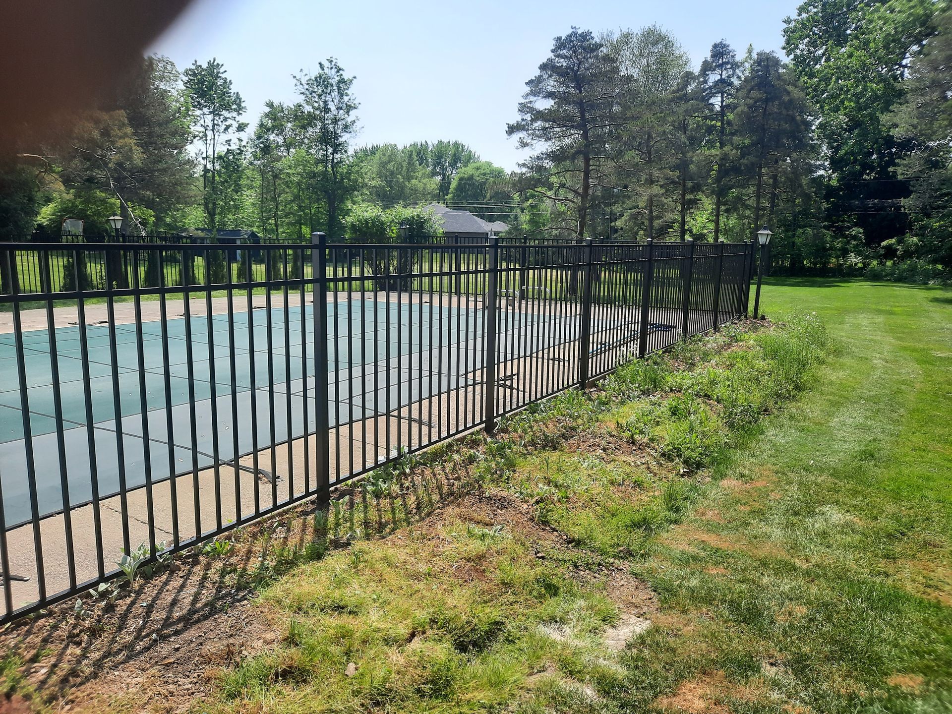 Wrought iron and aluminum fence installation in Delevan, NY by KKR Fencing
