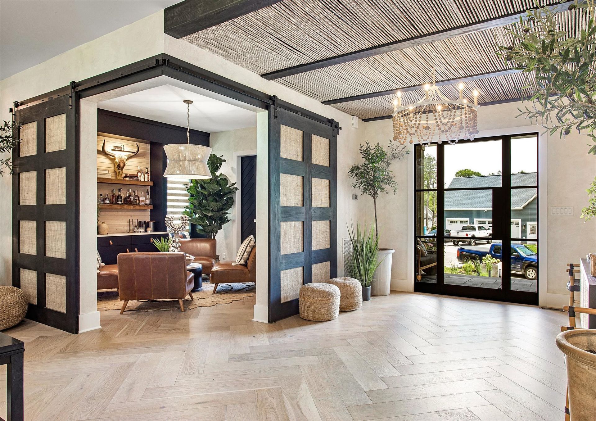 A living room with a lot of furniture and a sliding glass door.