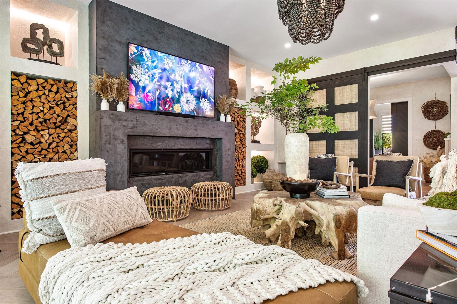 A living room with a fireplace and a flat screen tv.