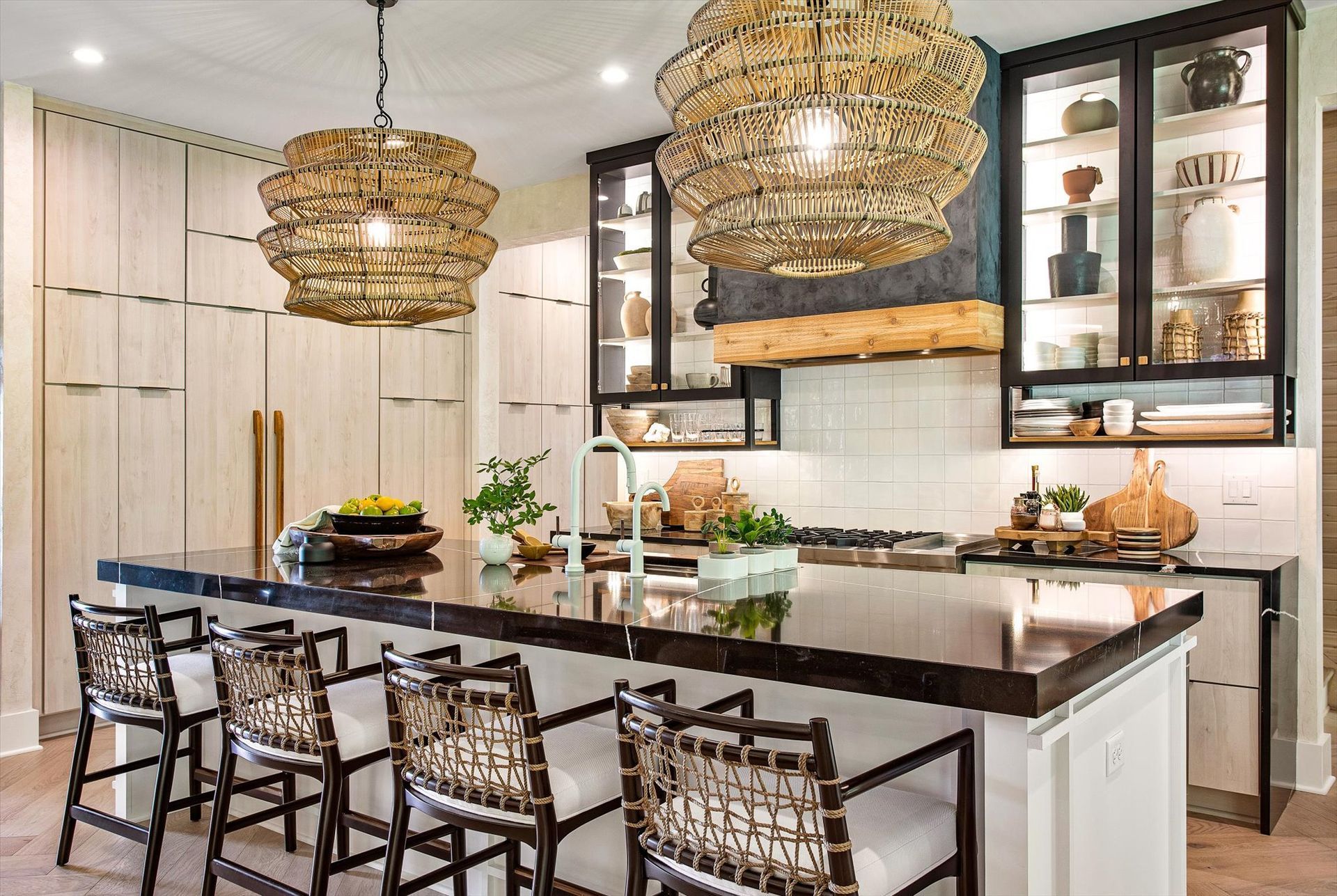 A kitchen with a large island and stools