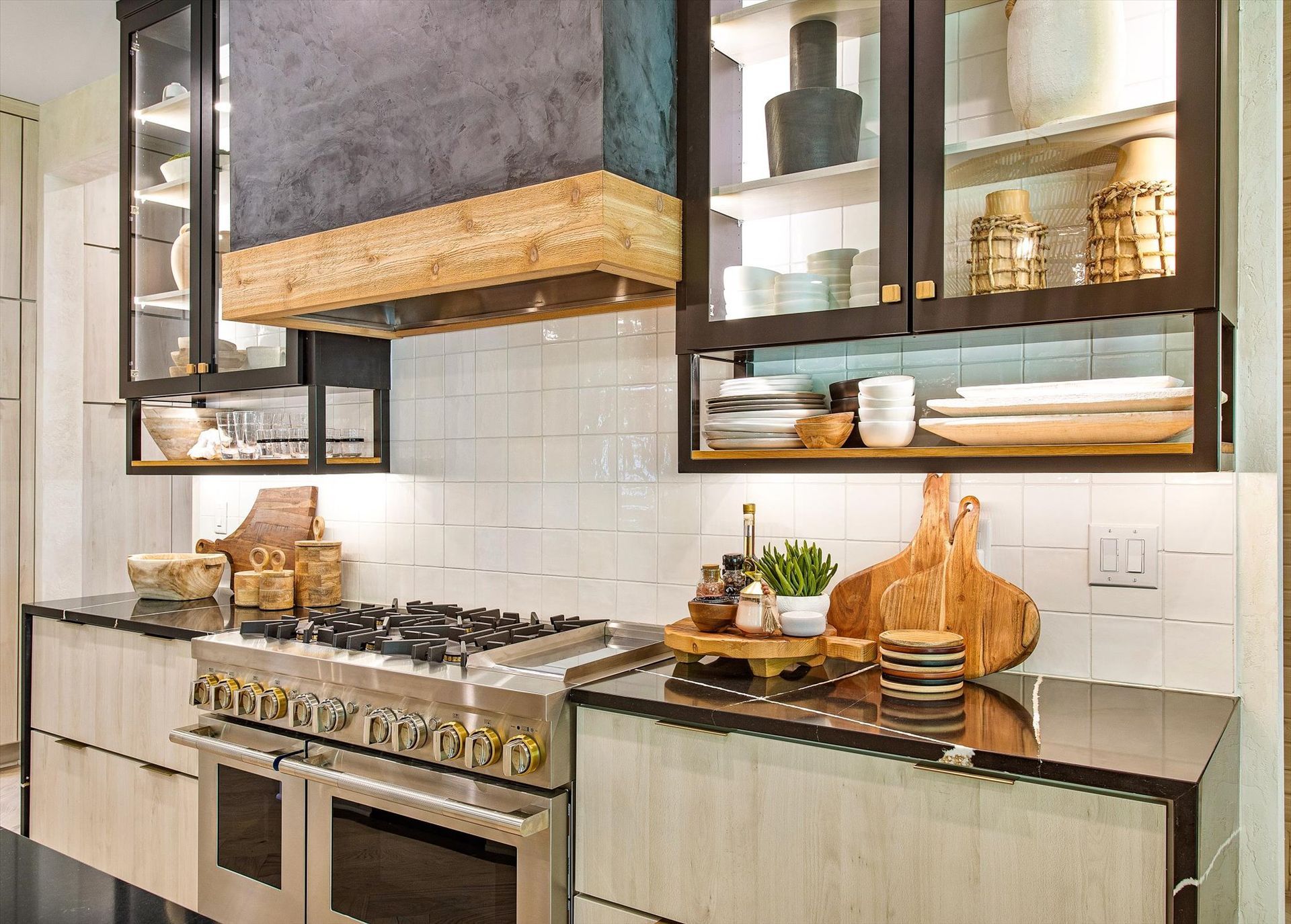 A kitchen with stainless steel appliances and wooden cabinets