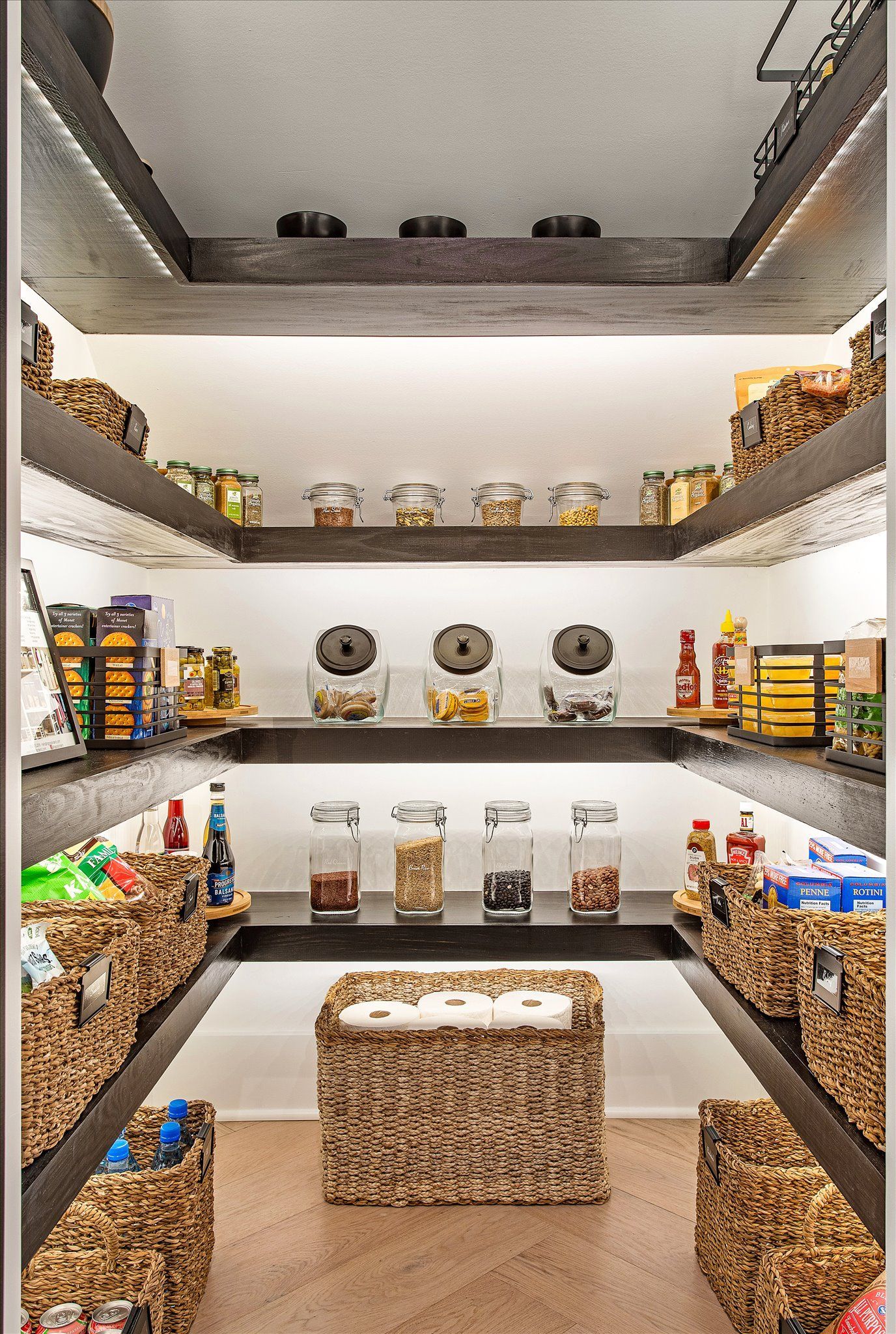 A pantry filled with lots of jars and baskets.