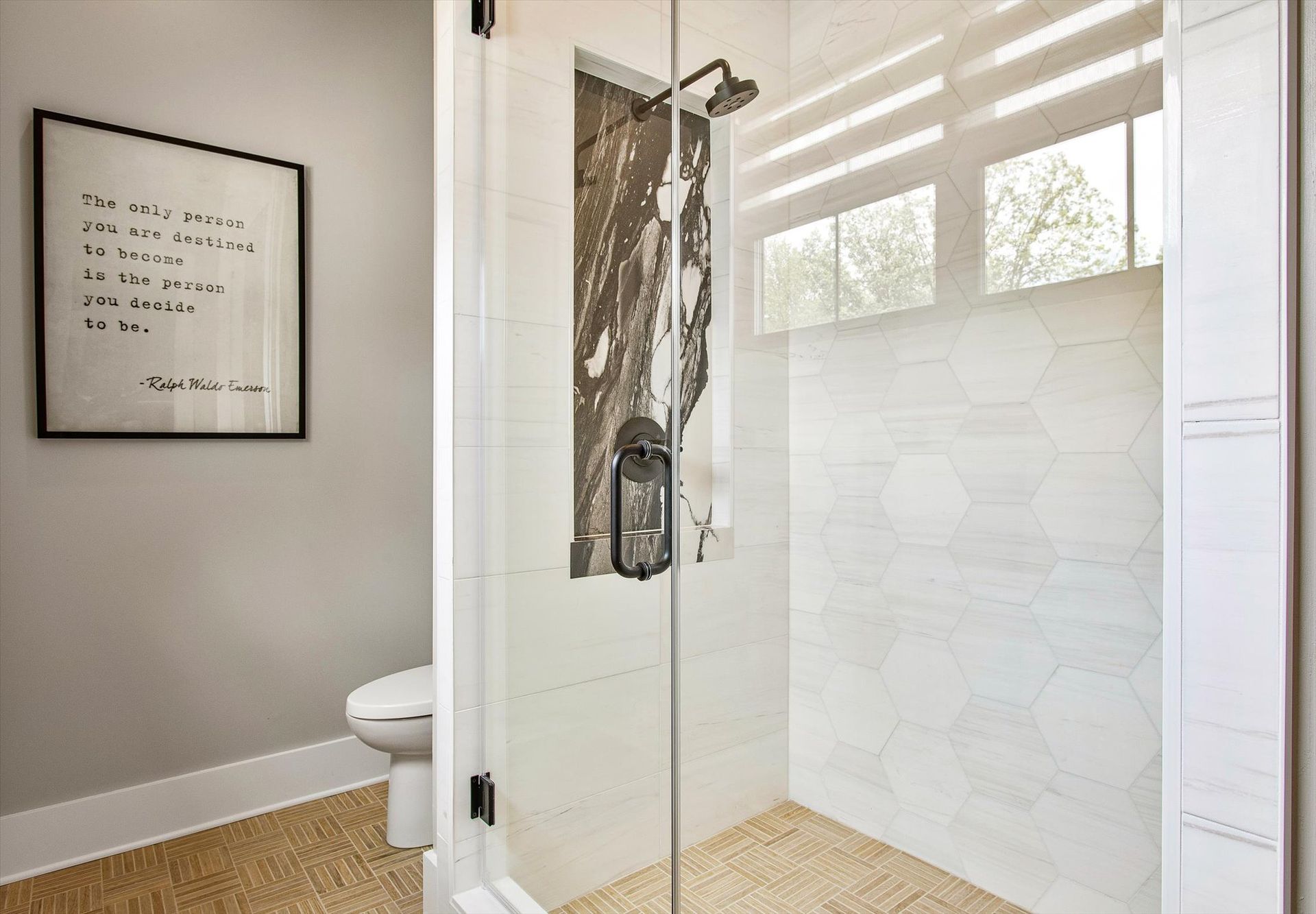 A bathroom with a walk in shower and a toilet.