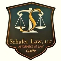 The logo for schafer law , llc is a shield with scales of justice on it.