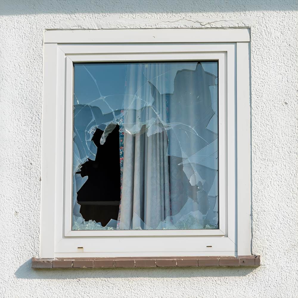 A White Window with A Broken Glass Pane — Boambee Gauze 'n' Glass in Harbour, NSW