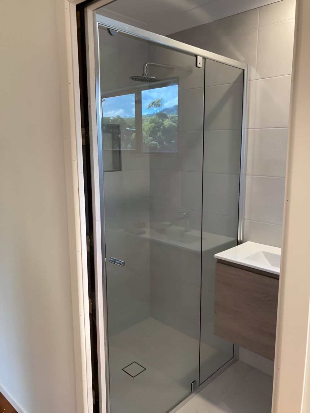 A Bathroom with A Sliding Glass Shower — Boambee Gauze 'n' Glass in Harbour, NSW