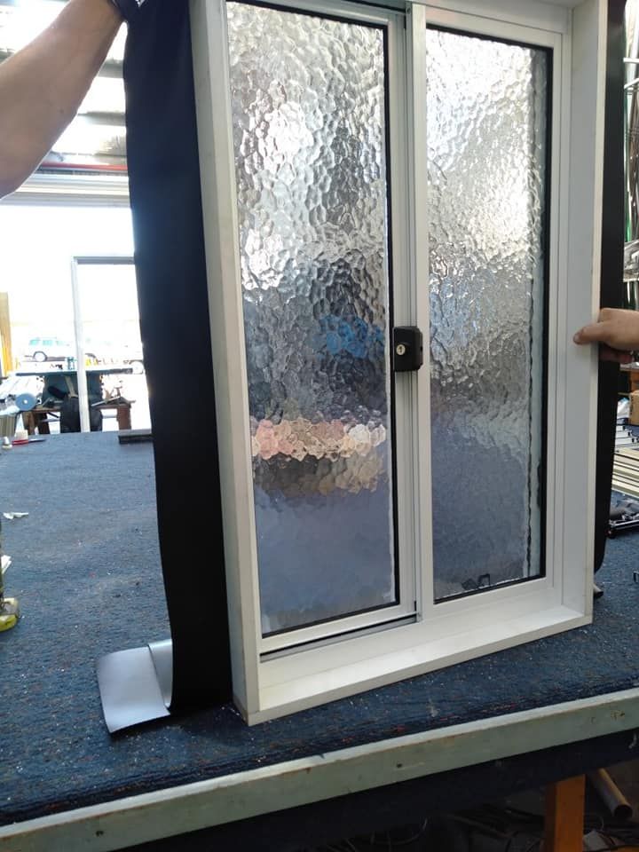 A Person Is Holding a Window on A Table — Boambee Gauze 'n' Glass in Harbour, NSW