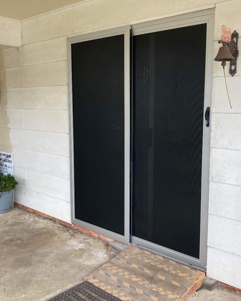 A Pair of Black Sliding Glass Doors — Boambee Gauze 'n' Glass in Harbour, NSW