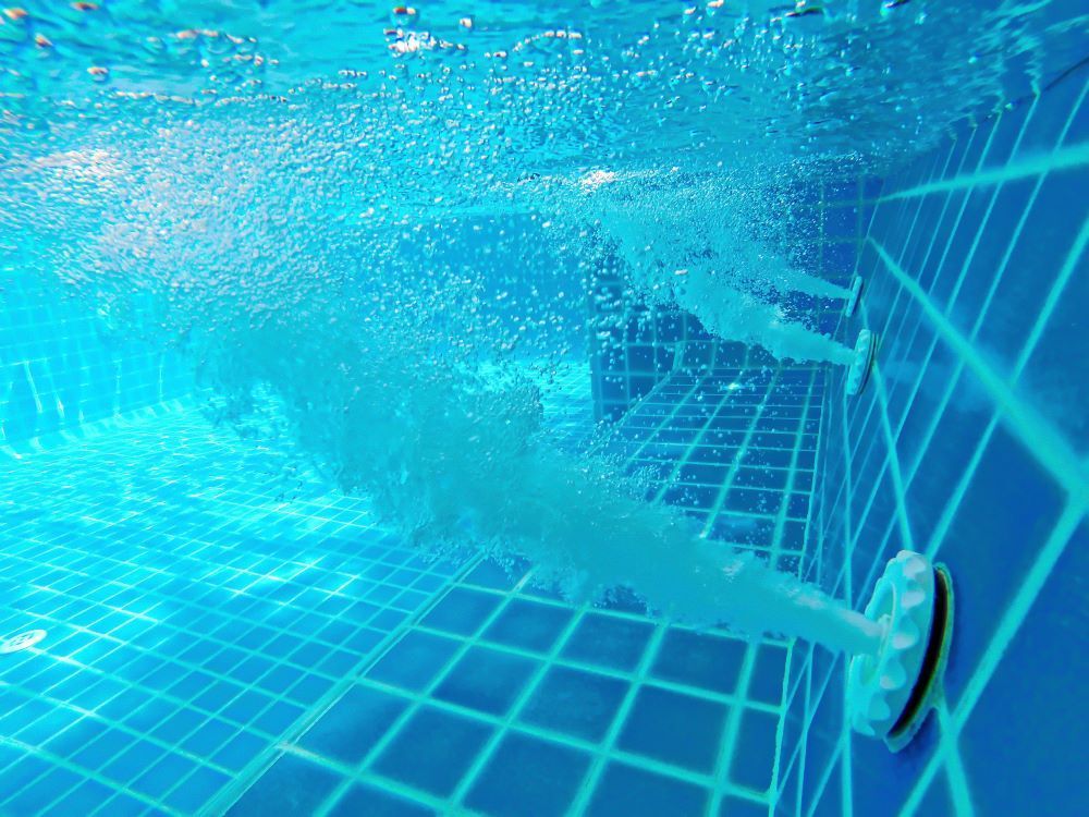 Underwater View of a Swimming Pool With Bubbles Coming Out of It — Figleaf Pool Products in Coolalinga , NT