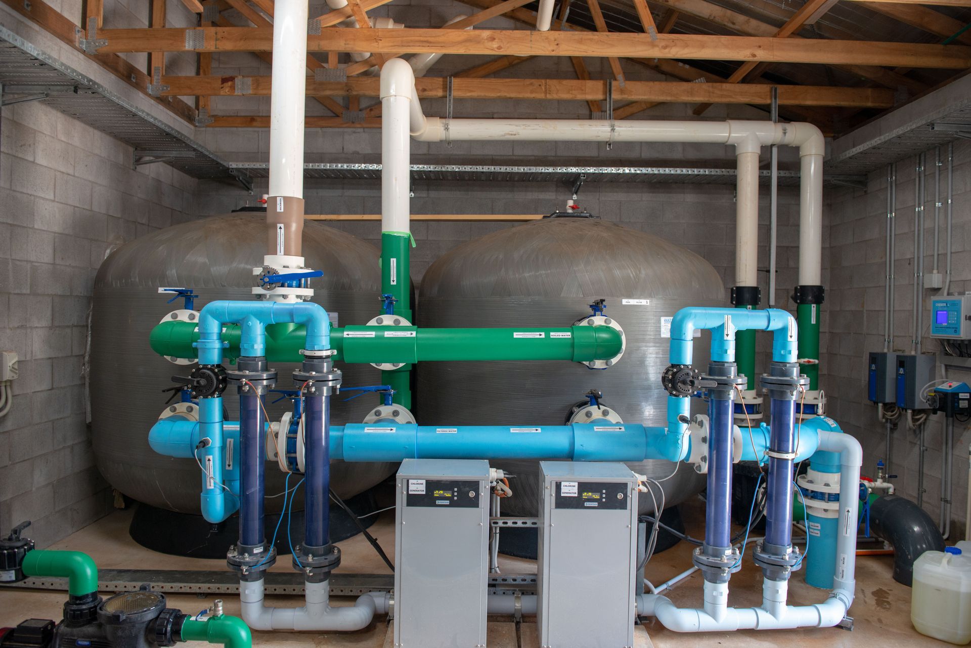 Swimming Pool FilterS With Blue and Green Pipes Attached to It — Figleaf Pool Products in Coconut Grove, NT