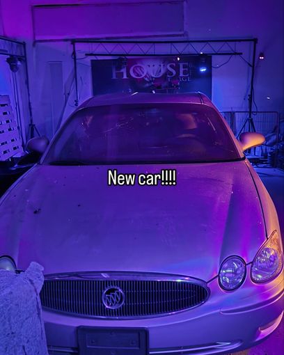 Silver sedan parked in a garage, lit purple, with “New car!!!” text overlay.