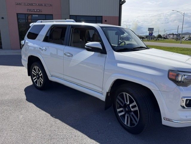 White SUV parked outside a building on a sunny day