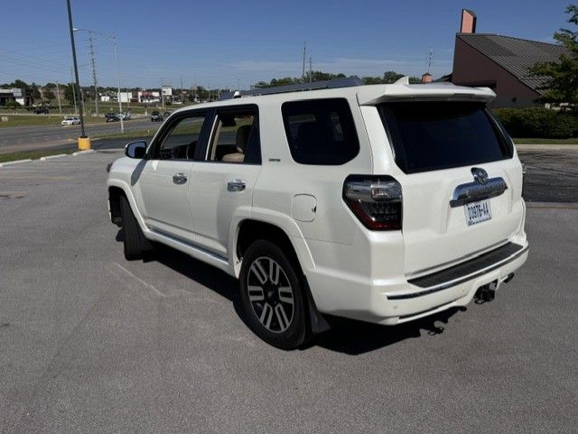 White SUV parked in a lot on a sunny day