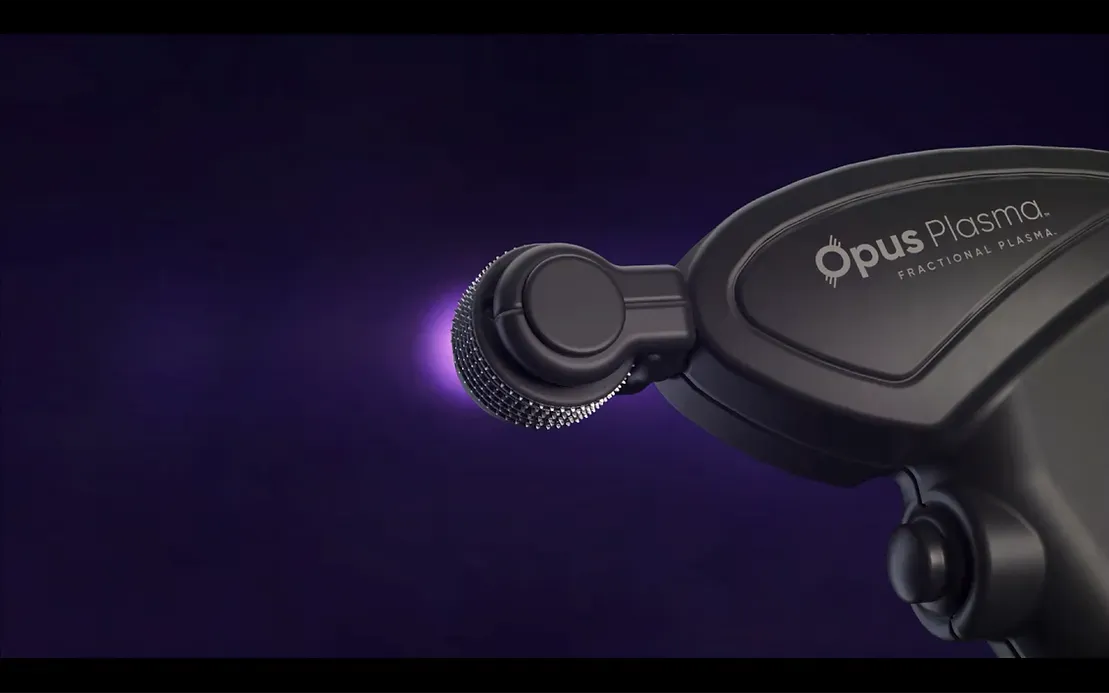 A close up of a black object on a purple background.