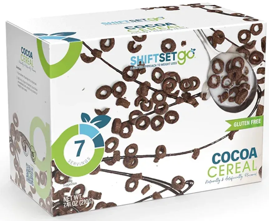 A box of cocoa cereal with a spoon in it