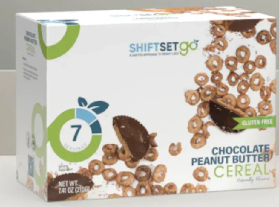 A box of chocolate peanut butter cereal is on a table